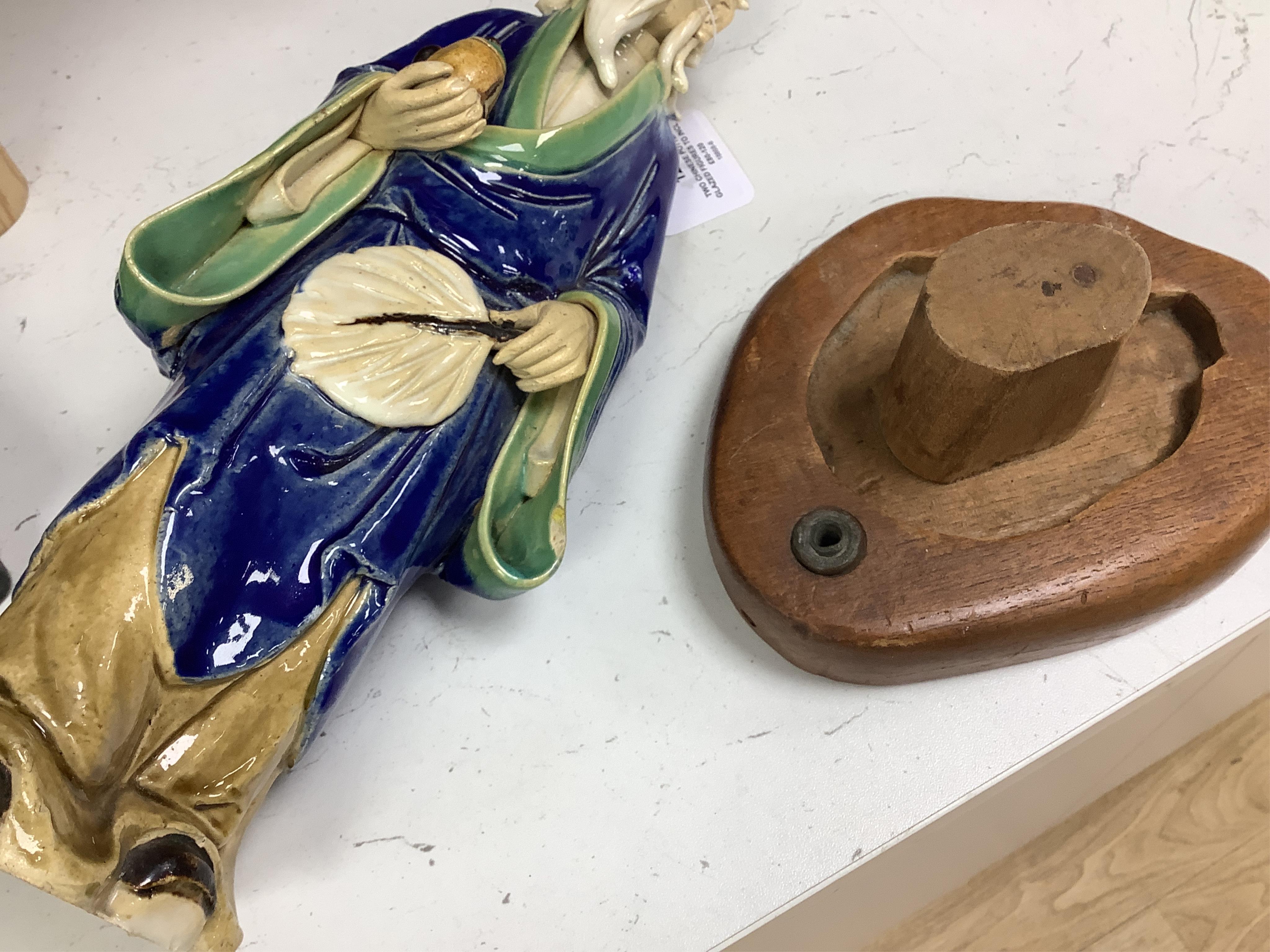 Two Chinese pottery glazed figures to include a Shiwan mudman, largest 48cm high